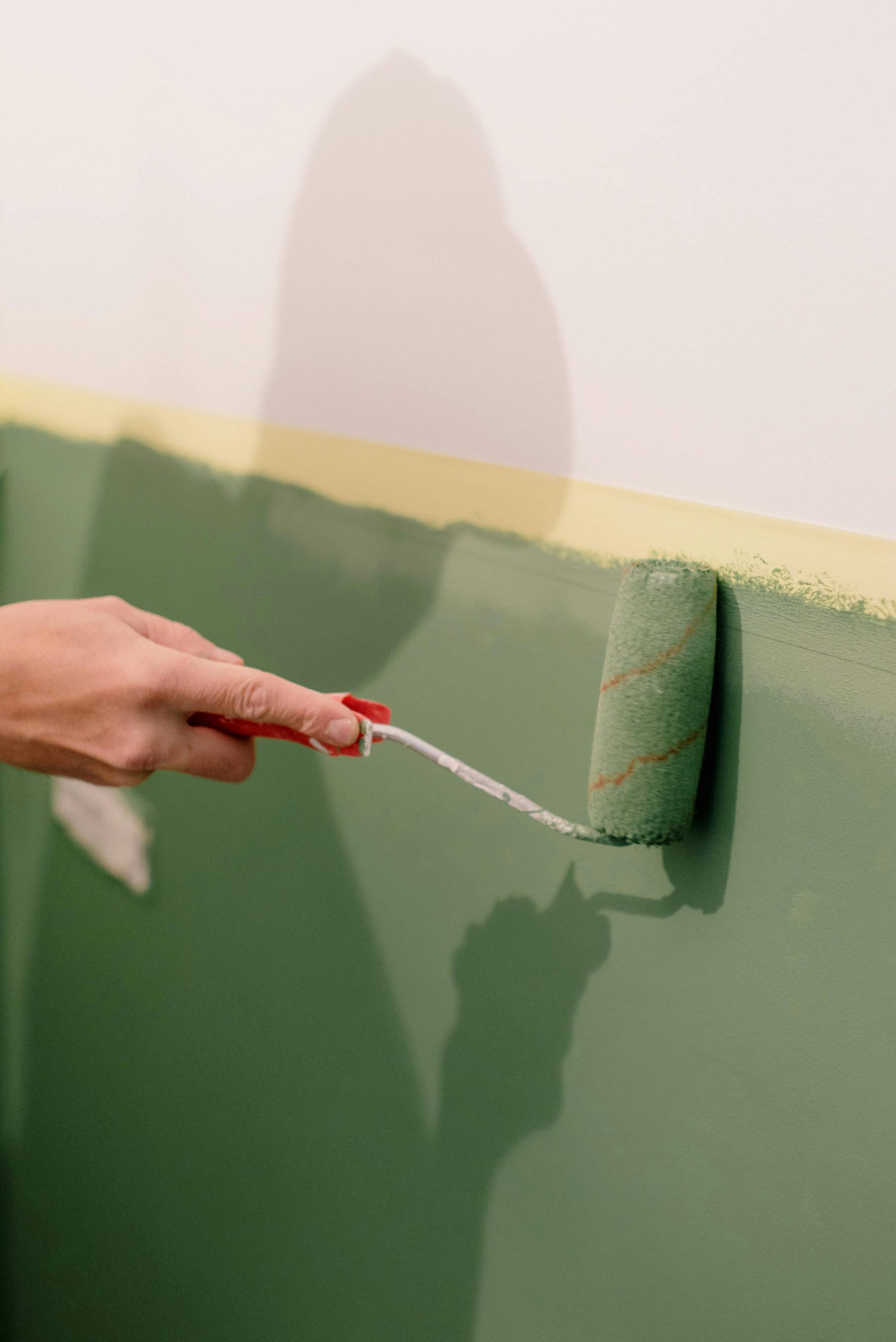 hand, holding paint roller